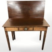 A George III mahogany turnover top gate leg table, fitted a drawer, width 91 cm.