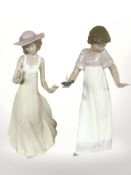 Two Nao figurines, numbers 1155 and 1158, both boxed.