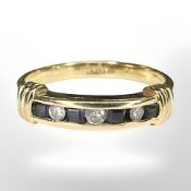 An 18ct yellow gold diamond and square cut sapphire ring, size Q.