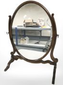 A Victorian mahogany oval dressing table mirror,