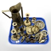 A tray of brass including candlesticks, horse brasses, etc.