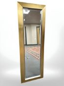 A contemporary bevelled rectangular mirror, 45 cm x 132 cm.