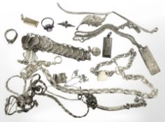 A group of white metal and silver jewellery including coin bracelet, chains, necklaces,