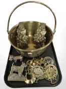 A large brass jam pan, horse brasses, two figures of terriers.