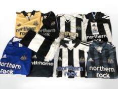 A group of Newcastle United Northern Rock football shirts, a further scarf.
