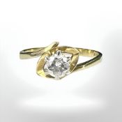 An 18ct yellow gold solitaire diamond ring, size S.