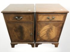 A pair of reproduction inlaid mahogany bedside cabinets, each 40 cm wide.