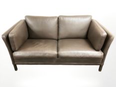 A late 20th century Danish brown leather two seater settee,