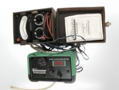 An avometer in leather case and a Gunson's exhaust gas tester.