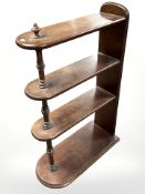 An Edwardian mahogany open bookshelf by Bartlett & Son Ltd, Bristol, length 59 cm.