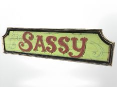 A painted wooden sign 