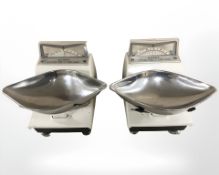 Two sets of enameled grocers scales.