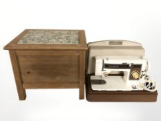 An oak sewing box and an Atlantis sewing machine