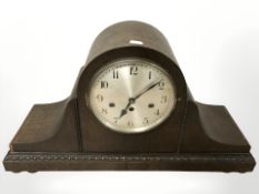 An early 20th century large oak eight day mantel clock, width 58 cm.