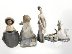 Three Lladro figures numbers 5722, 4635 and 5598 and a Nao figure 11041,