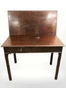 A George III mahogany turnover top tea table, width 91 cm.