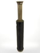 An antique brass and leather mounted telescope.