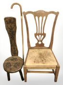 A carved oak spinning chair, a further chair and a walking stick.