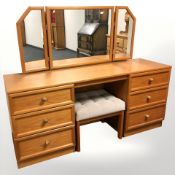 A teak six drawer mirror backed dressing table,
