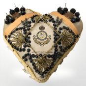 A World War I sweetheart pin cushion to the South Wales Borderers, 24th Foot, width 17 cm.