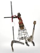 A table lamp adapted from a bunsen burner stand and another in the form of a revolver and horseshoe.
