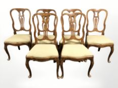 A set of six 18th century Dutch walnut and marquetry dining chairs with floral inlaid hourglass