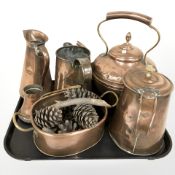 A Victorian copper kettle and several jugs,