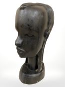An African carved hardwood bust, height 24 cm.