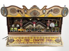 An 'Old Time Country Fair' musical wagon, with brass inset plaque 'Built 1974, F Trevett, Chalbury',