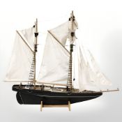 A scale model two masted ship, length 100 cm.