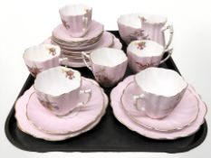 Twenty one pieces of Victoria bone china tea china on pink ground