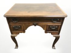 A George III walnut three drawer low boy, 80 cm x 53 cm x 71 cm.