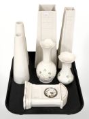 A group of Belleek porcelain vases and a quartz mantel timepiece