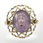 A 9ct yellow gold ring set with an amethyst, size J/k. CONDITION REPORT: 2.
