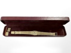 A Lady's Omega DeVille wristwatch on gold plated flat-link strap, dial 8 mm.