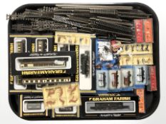 A group of Graham Farish N gauge railway rolling stock including passenger cars, locomotive,