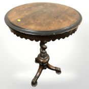 A Victorian rosewood and ebonised circular tripod occasional table, diameter 53 cm.