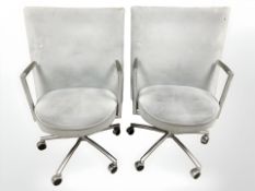 A pair of Danish Erik Jorgensen designed 'Partner' chrome-framed executive swivel armchairs,