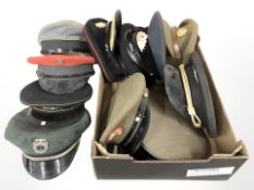 A quantity of military caps.