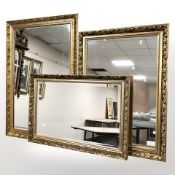 Three reproduction gilt framed mirrors, largest 97 cm x 67 cm.