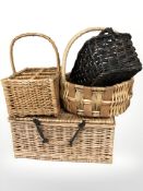 A wicker picnic hamper and three baskets, largest 52 cm wide.