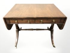 A Regency mahogany and ebony strung drop leaf sofa table,