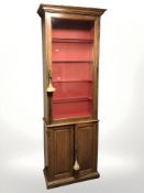 A late Victorian glazed oak single door gun cabinet by Army & Navy CSL Makers,