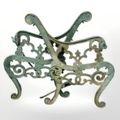 A pair of painted cast iron bench ends.