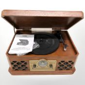 A Zennox vintage style music centre with instructions.