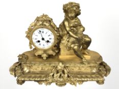 A 19th century French gilt metal figural eight day mantel clock, height 32 cm.