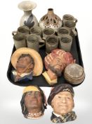 A group of Bosson's wall plaques, studio pottery coffee cans,