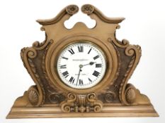 A large Winterhalder & Hofmeier mantel clock in elaborate carved case,