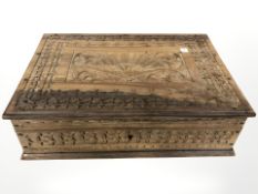 An Indian heavily carved hardwood table box,