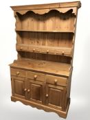A contemporary pine kitchen dresser,